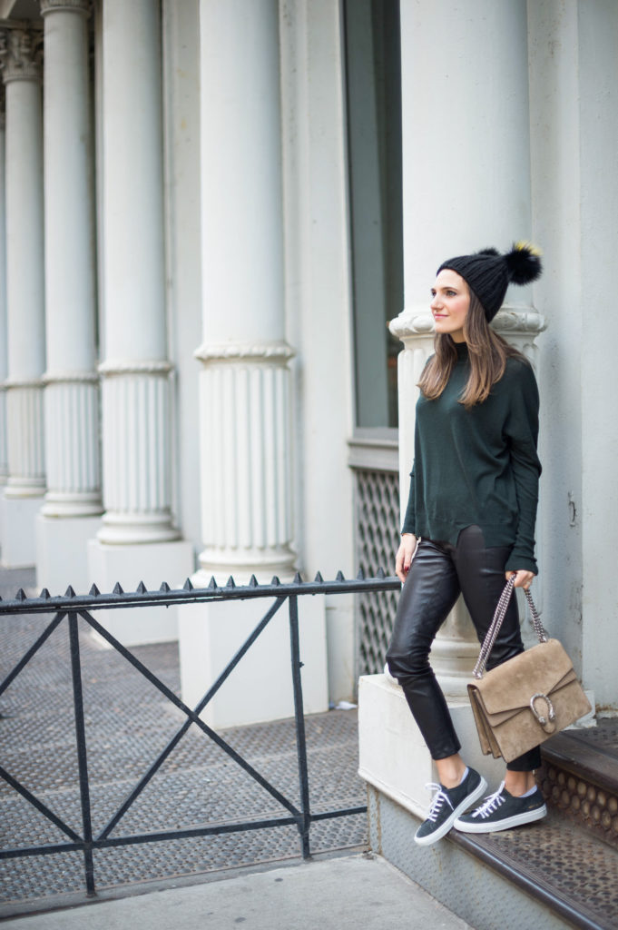 Lifestyle blogger That Pencil Skirt wearing a J Brand turtleneck sweater, leather leggings, Common Projects sneakers, Gucci bag and Eugina Kim hat