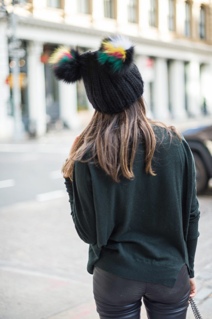 lifestyle blogger That Pencil Skirt wearing leather pants, a J Brand sweater and a Eugina Kim hat 