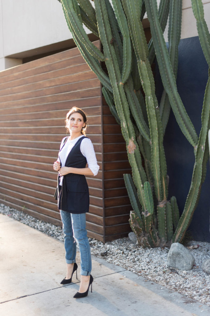 Lifestyle and corporate blogger That Pencil Skirt wearing a Marisa Webb vest and Rag and Bone boyfriend jeans