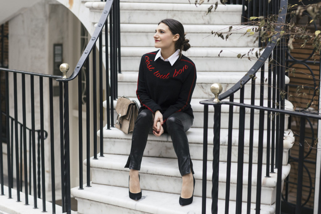 Lifestyle and corporate blogger That Pencil Skirt wearing leather pants, a Cinq a Sept sweater, white button down blouse and Gucci bag