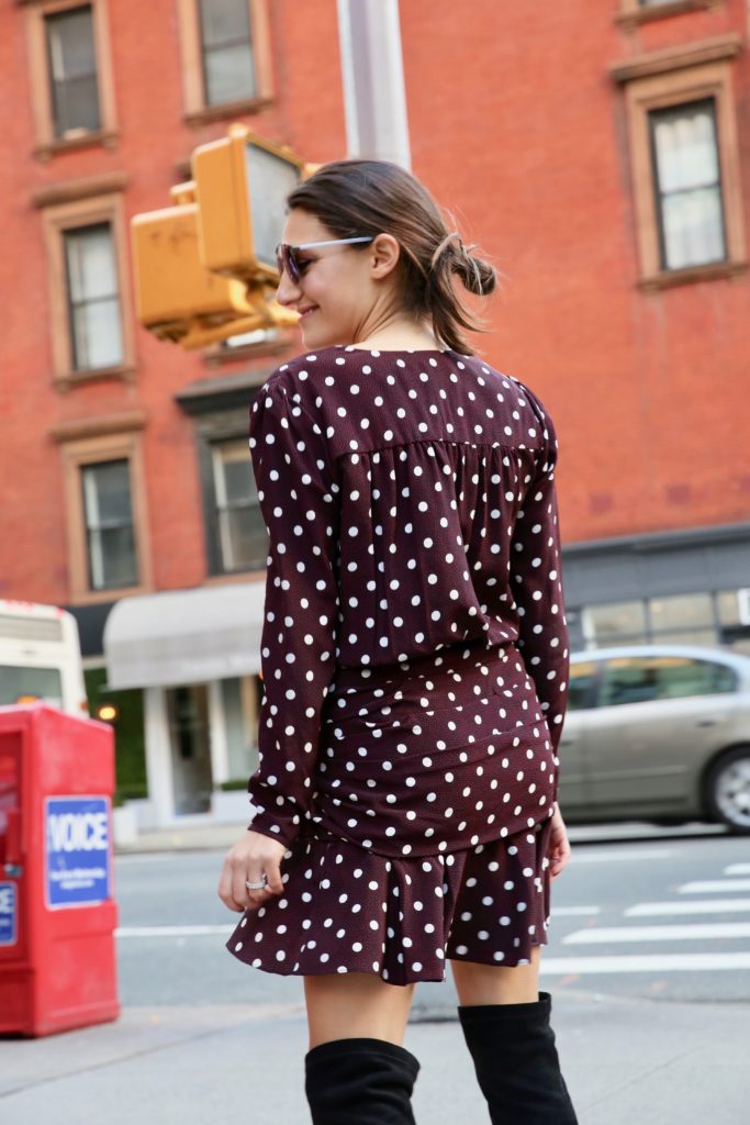 That Pencil Skirt wearing a Veronica Beard polka dot dress, Joie over the knee boots and Dior sunglasses.
