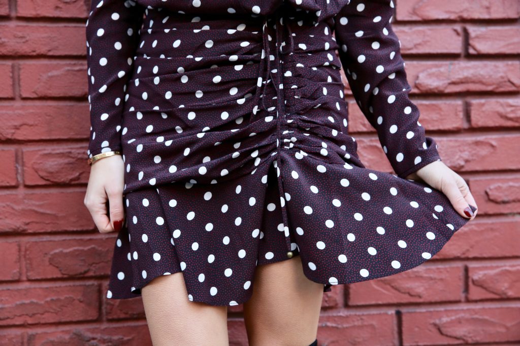 That Pencil Skirt wearing a Veronica Beard polka dot dress, Joie over the knee boots and Dior sunglasses.