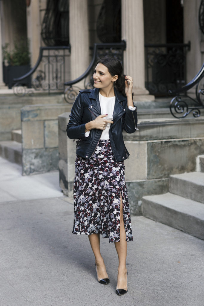 Corporate blogger Amanda Warsavsky wearing a Veronica Beard a line midi skirt, white ruffle top, Gianvito Rossi pumps and and Iro navy leather jacket