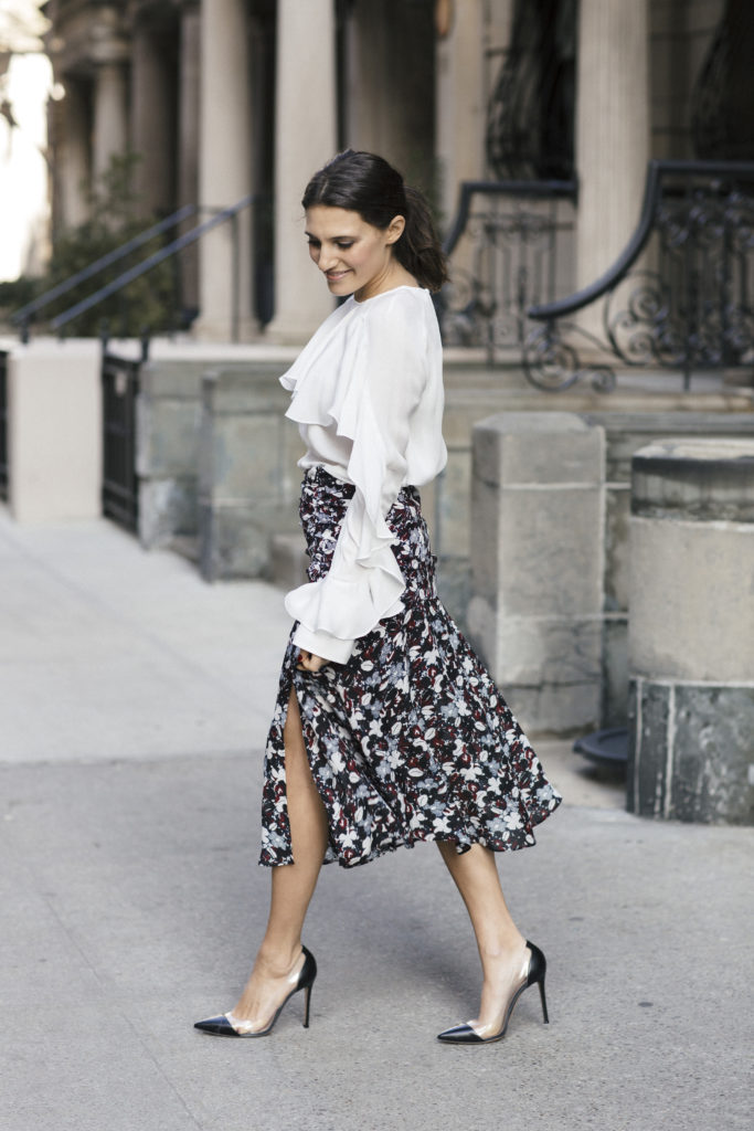 Corporate blogger Amanda Warsavsky wearing a Veronica Beard a line midi skirt, white ruffle top, and Gianvito Rossi leather and plexipumps