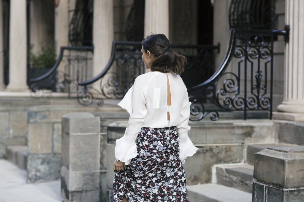 Corporate blogger Amanda Warsavsky wearing a Veronica Beard a line midi skirt, white ruffle top, and Gianvito Rossi leather and plexipumps