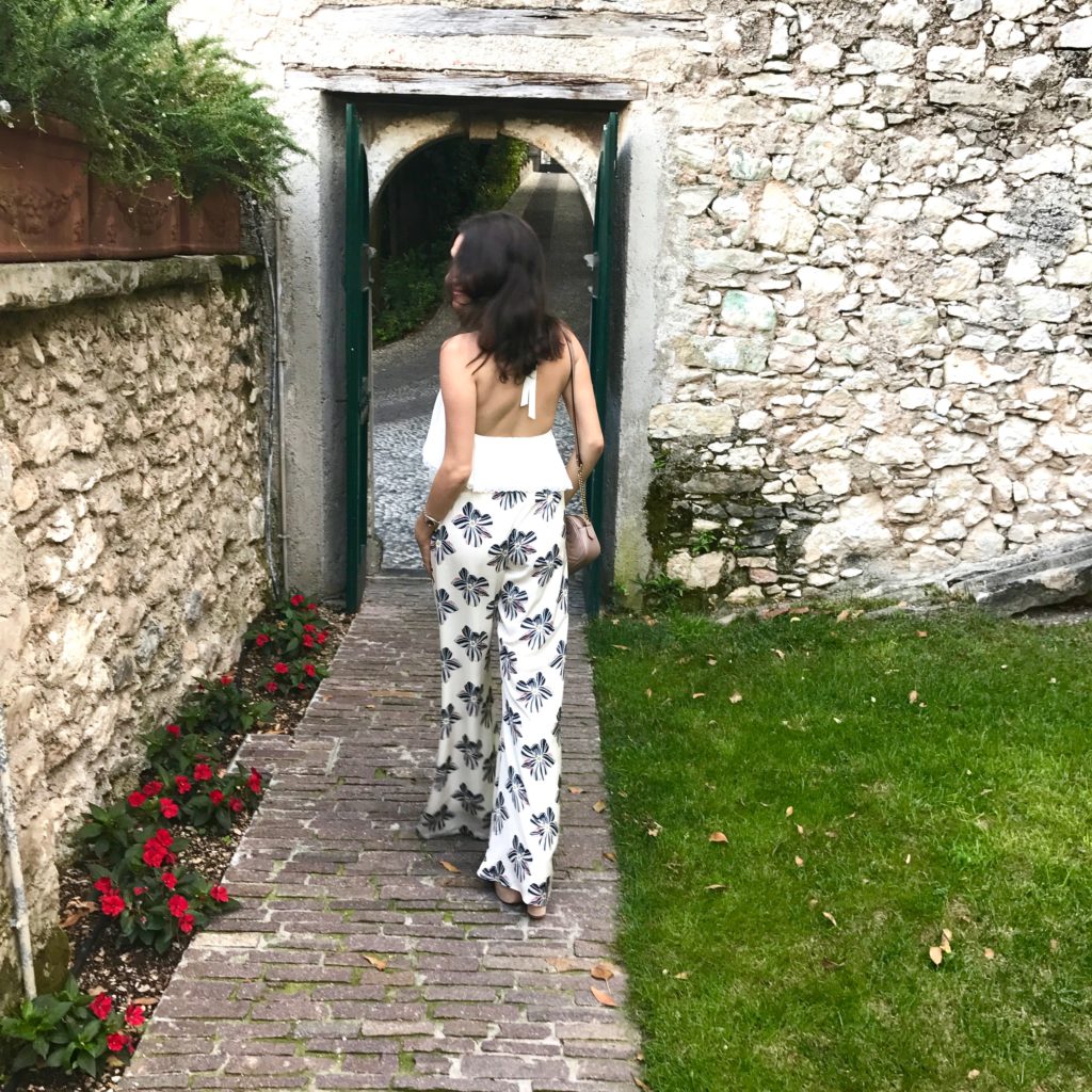 That Pencil Skirt wearing Alexis Silk pants and an Alice and Olivia halter top in Lake Garda