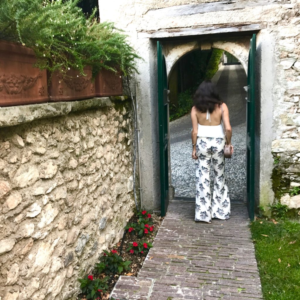 That Pencil Skirt wearing Alexis Silk pants and an Alice and Olivia halter top in Lake Garda