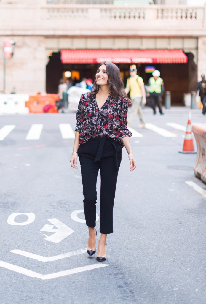 Lifestyle and work style blogger That Pencil Skirt wearing a black printed floral ba&sh blouse and tie waist black trousers