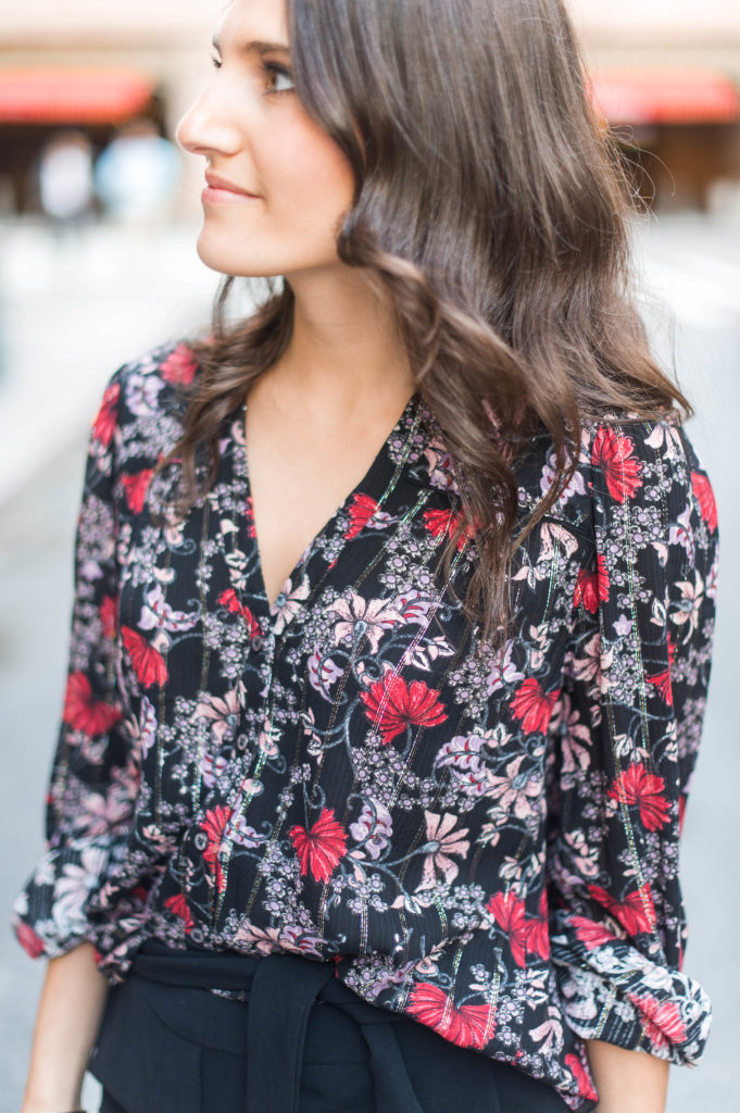 Lifestyle and work style blogger That Pencil Skirt wearing a black printed floral ba&sh blouse and tie waist black trousers