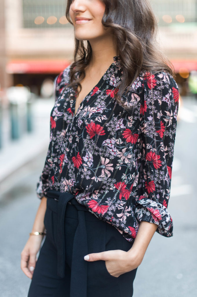 Lifestyle and work style blogger That Pencil Skirt wearing a black printed floral ba&sh blouse and tie waist black trousers