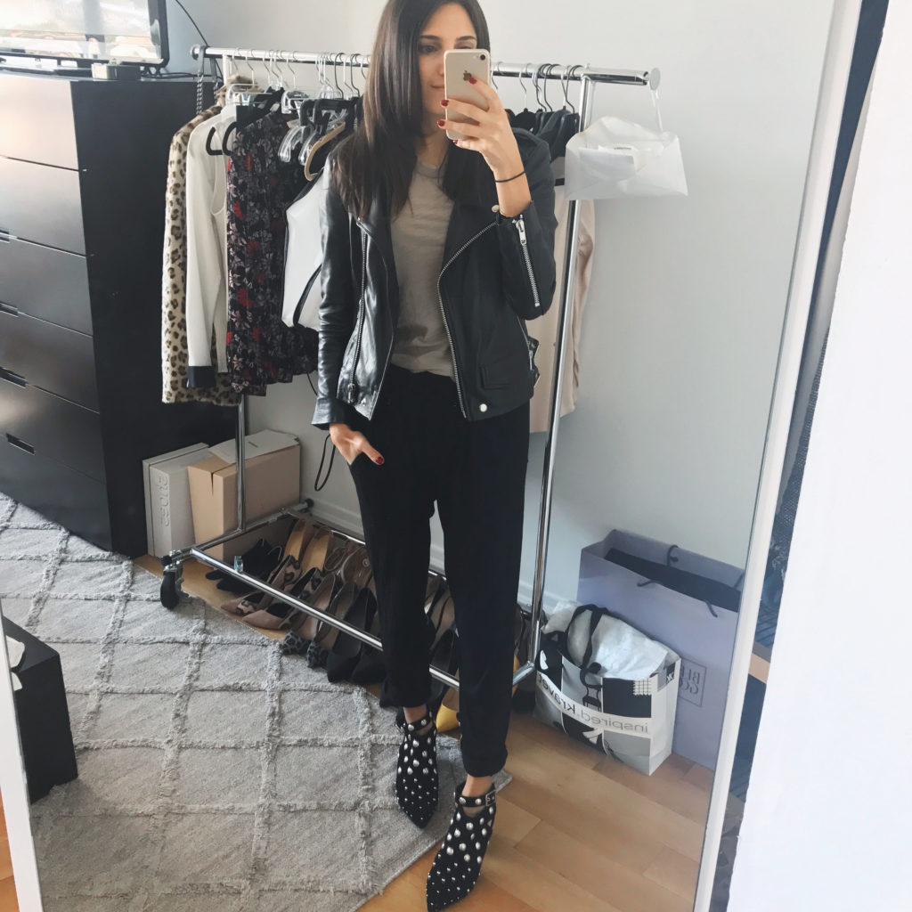 Work style blogger That Pencil Skirt wearing an inexpensive Oak real leather jacket, Topshop studded open back booties, and black jogger pants. 