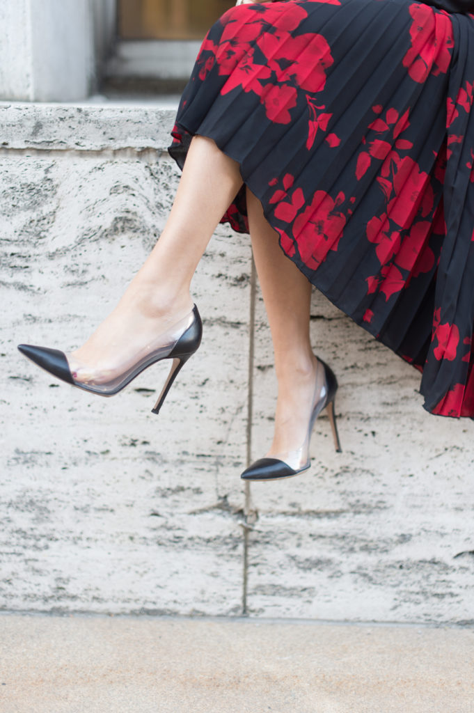 Lifestyle and work wear inspiration blogger That Pencil Skirt wearing a H&M red and navy pleated midi skirt and Gianvito Rossi plexi and black leather pump