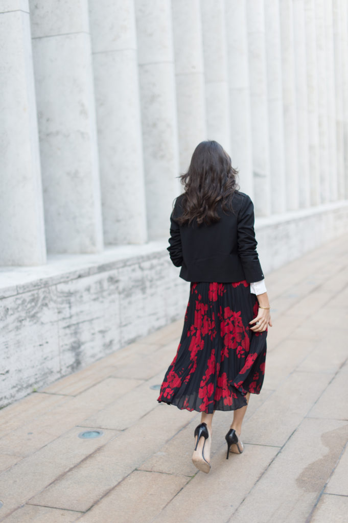 Lifestyle and work wear inspiration blogger That Pencil Skirt wearing a H&M red and navy pleated midi skirt and Gianvito Rossi plexi and black leather pump and a Ba&sh crop black blazer