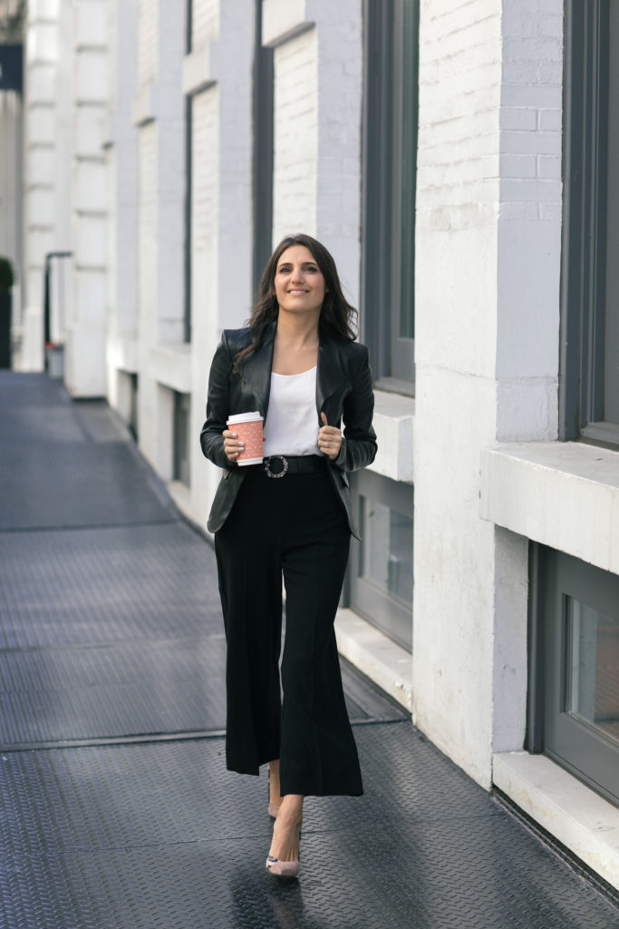 Lifestyle and work wear blogger That Pencil Skirt wearing a Theory peplum leather jacket, Miu Miu embellished belt and wide leg black pants