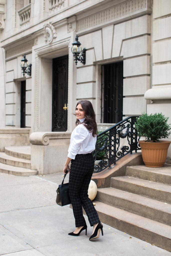 Lifestyle and workwear blogger That Pencil Skirt wearing a Frame ruffle collar Victorial blouse, Alice and Olicia Stacy windowpane pants, a Celine bag and black suede pointed toe Jimmy Choo pumps