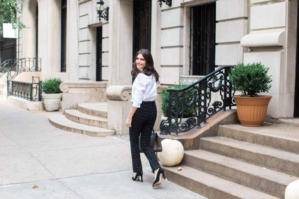 Lifestyle and workwear blogger That Pencil Skirt wearing a Frame ruffle collar Victorial blouse, Alice and Olicia Stacy windowpane pants, a Celine bag and black suede pointed toe Jimmy Choo pumps