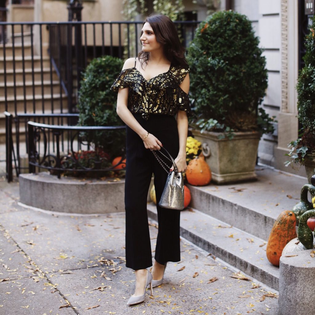 Lifestyle and work wear inspiration blogger That Pencil Skirt wearing a Veronica Beard metallic off the shoulder top with wide leg crop black trousers and a jerome dreyfus silver popeye bucket bag