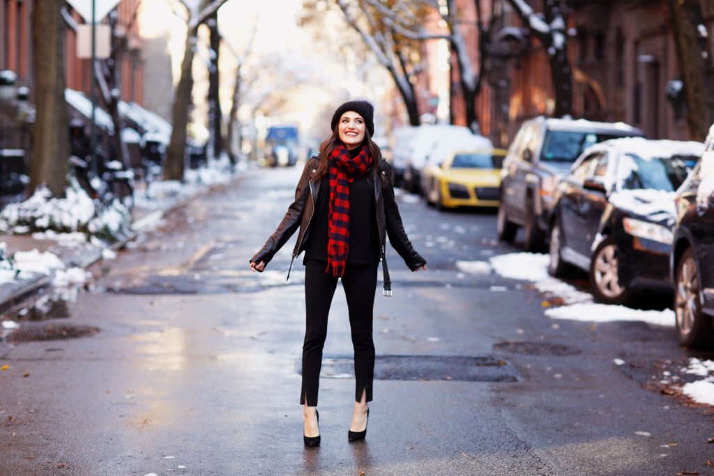 That Pencil Skirt, a lifestyle blogger, wearing Ann Taylor maternity friendly leggins with a front slit, a red and blue check scarf and a pom pom hat