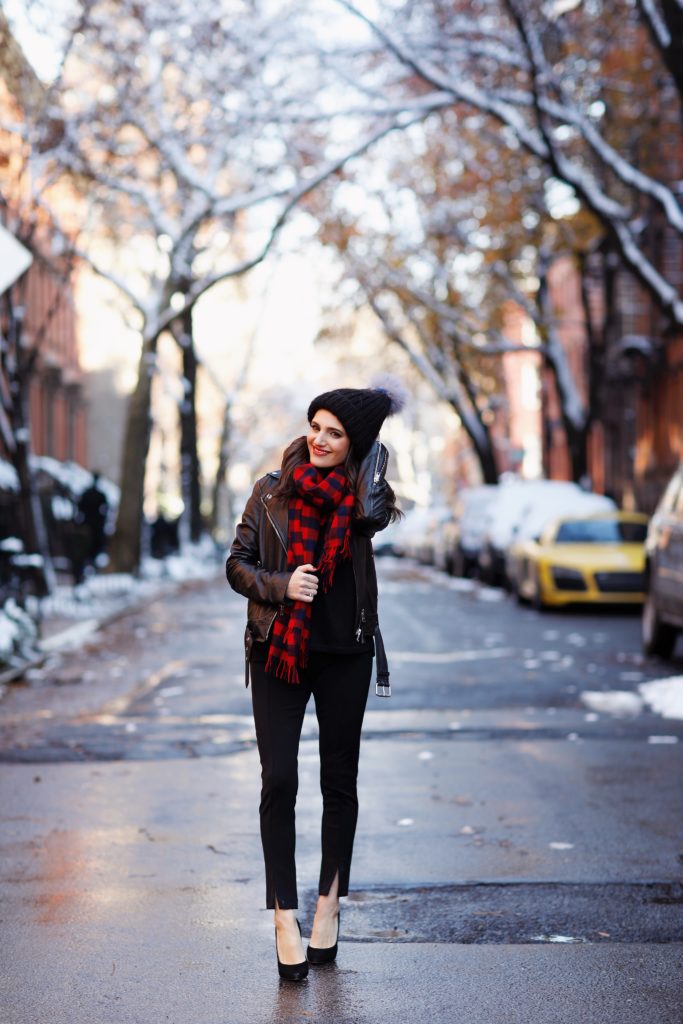 That Pencil Skirt, a lifestyle blogger, wearing Ann Taylor maternity friendly leggins with a front slit, a red and blue check scarf and a pom pom hat