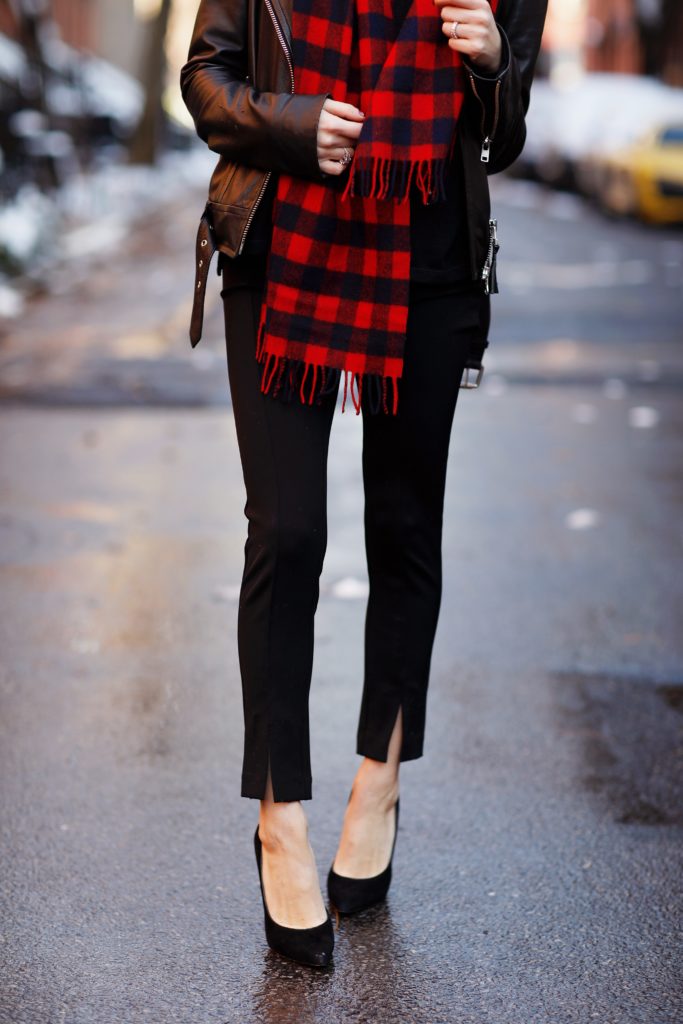 That Pencil Skirt, a lifestyle blogger, wearing Ann Taylor maternity friendly leggins with a front slit, a red and blue check scarf and a pom pom hat